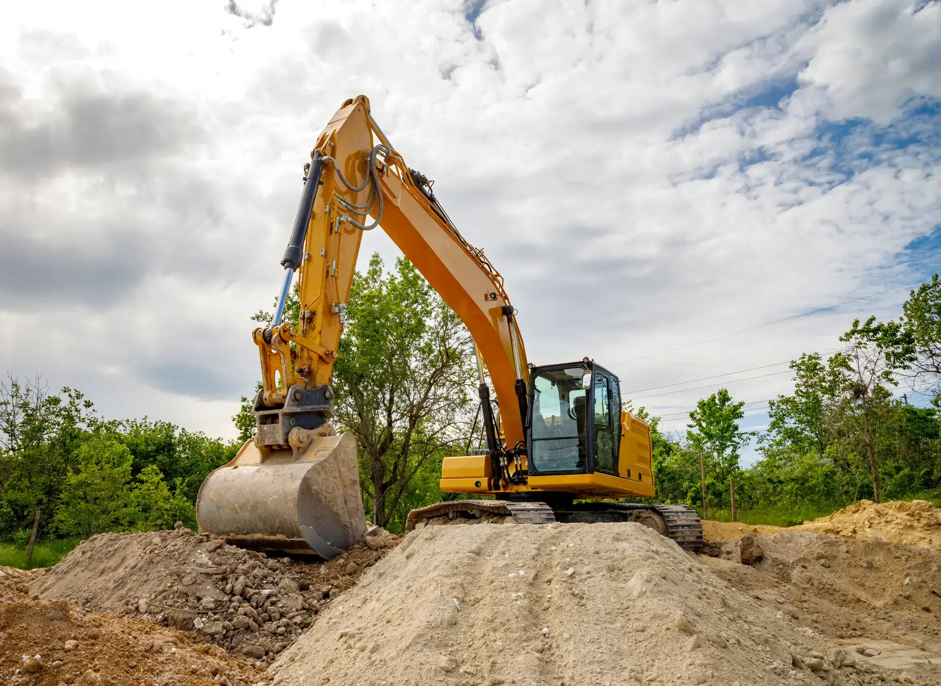 3L Land Services excavator digging spoil pile rocky soil rural site ivanhoe tx 3l land services